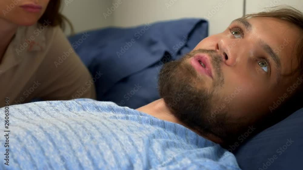The concept of a problem in a pair. sexual problems. couple in bed. the woman expresses her displeasure to the man. The concept of a problem in a pair. sexual problems. couple in bed. the woman expresses her displeasure to the man.
