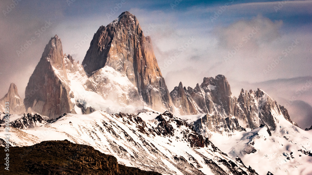 Mountains in Patagonia. Mount Fitz Roy in El Chalten, Argentina. Landscape of mountain range with snow and fog.