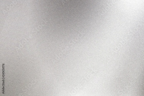Abstract texture background, light shining on rough stainless steel