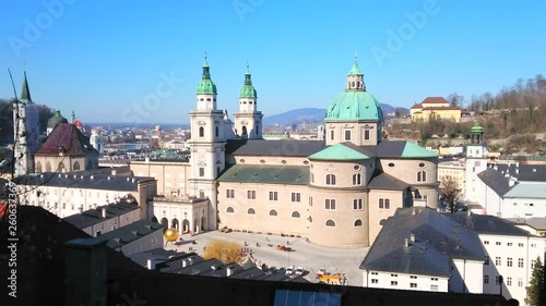 Observe Baroque Cathedral (Dom) of St Rupert and St Vergilius, wide Kapitelplatz square in front of it and the apse of Franciscan church from the Festunsberg hill, Salzburg, Austria. photo