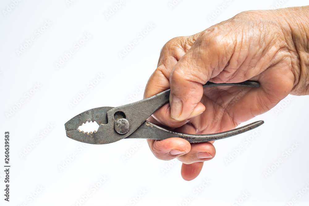 Senior Woman's right hand holding silver metal pliers on white background, Construction building and repair tool concept Senior Woman's right hand holding silver metal pliers on white background, Construction building and repair tool concept