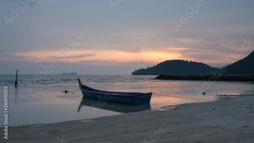 Timelapse sunset at Permatang Damar Laut fisherman village photo