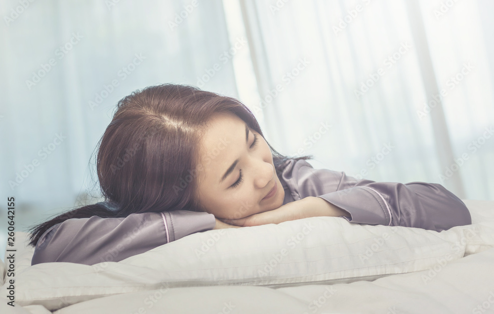 Asian woman sleep on white pillow on bed in bedroom in holiday.happy relax time. Asian woman sleep on white pillow on bed in bedroom in holiday.happy relax time.