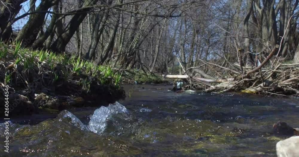 Typical mountain scenery, where the sun lightens the water to a spring Typical mountain scenery, where the sun lightens the water to a spring