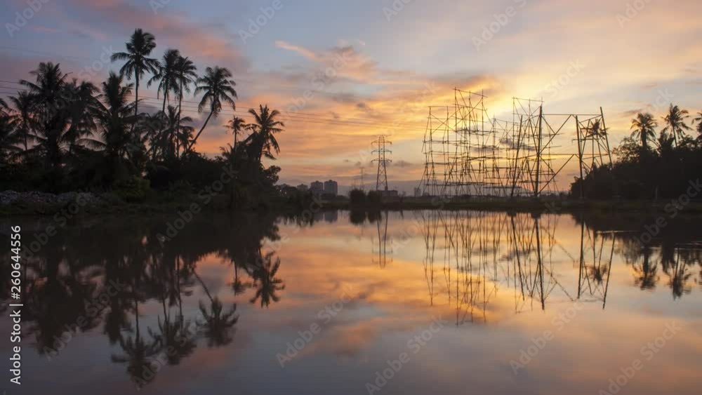 Timelapse gorgeous sunset over the architecture and coconut trees reflect in water. Timelapse gorgeous sunset over the architecture and coconut trees reflect in water.