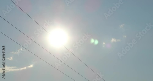 The sun walked on the electric cables photo