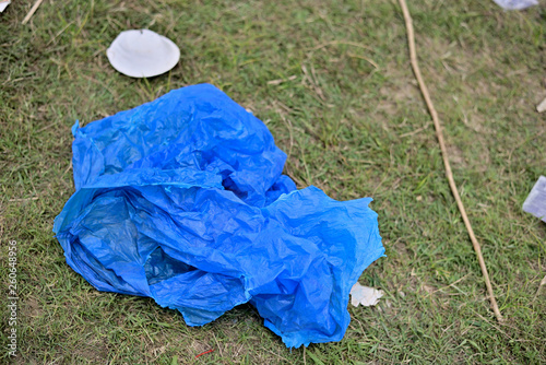 Waste Plastic packets are dumped on dirty soil ground