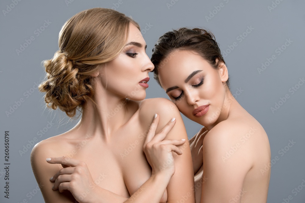 Foto de Naked women touching each other do Stock