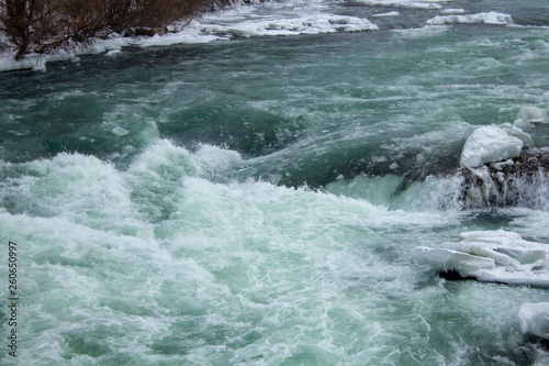 Rapid icy water at winter Niagara Falls