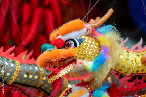 Colourful traditional souvenirs in china market, Chinatown, Singapore. Chinese dragon close up. Chinese New Year decoration