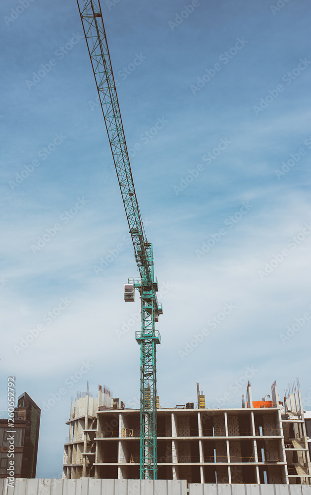 Construction crane building new building outdoor. Urban story Construction crane building new building outdoor. Urban story