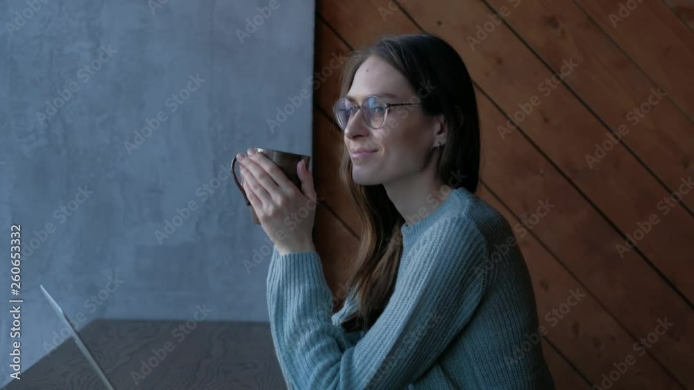 Beautiful woman with good mood sitting in cafe and drinks coffee enjoy the taste. Beautiful woman with good mood sitting in cafe and drinks coffee enjoy the taste.