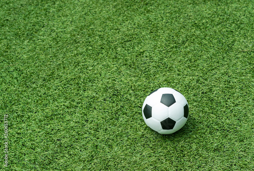 football field soccer ball on green grass , soccer field background texture