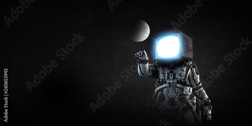 Astronaut with TV head on black background. Mixed media. © Sergey Nivens