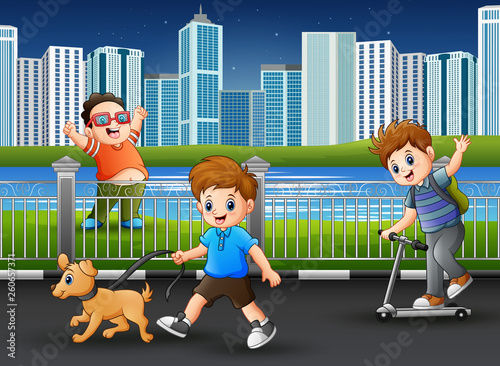 Happy boys playing at the park road