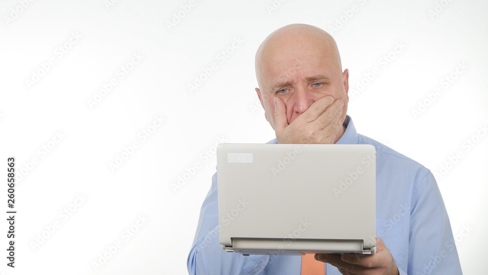 Disappointed Businessman Image Reading Bad Financial News on Laptop Disappointed Businessman Image Reading Bad Financial News on Laptop