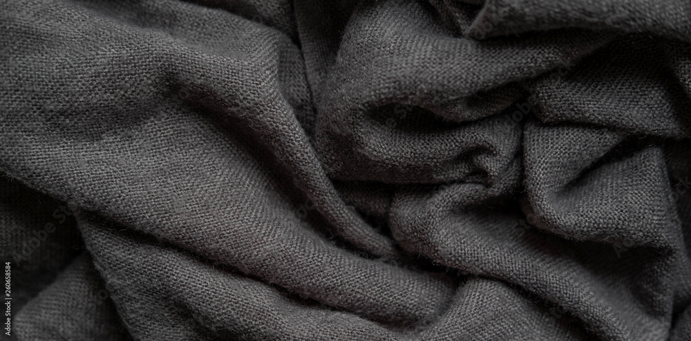 Macro photo of fabric gray. Knitting, wool. Texture of fabric with folds for designers. Blank for banner atelier, mester Macro photo of fabric gray. Knitting, wool. Texture of fabric with folds for designers. Blank for banner atelier, mester