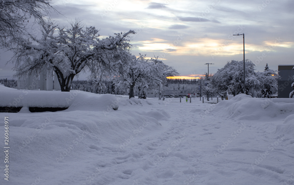 Sunset after winter storm blizzard. Snow covered campus at University of Alaska Fairbanks UAF