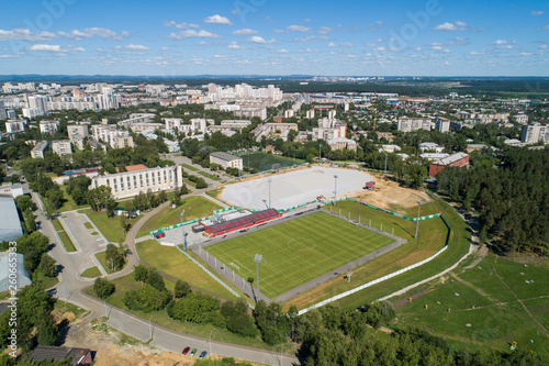 Top down aerial drone image of a Ekaterinburg with stadiums: ready and under construction. Midst of summer, backyard turf grass and trees lush green.