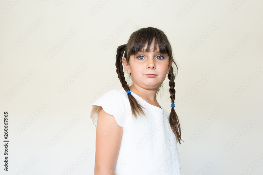 Beautiful girl with braided hair looking at camera Beautiful girl with braided hair looking at camera