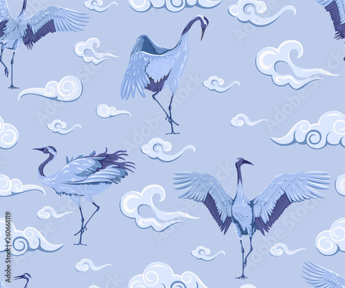 Seamless pattern with japanese cranes and clouds. Blue pottery
