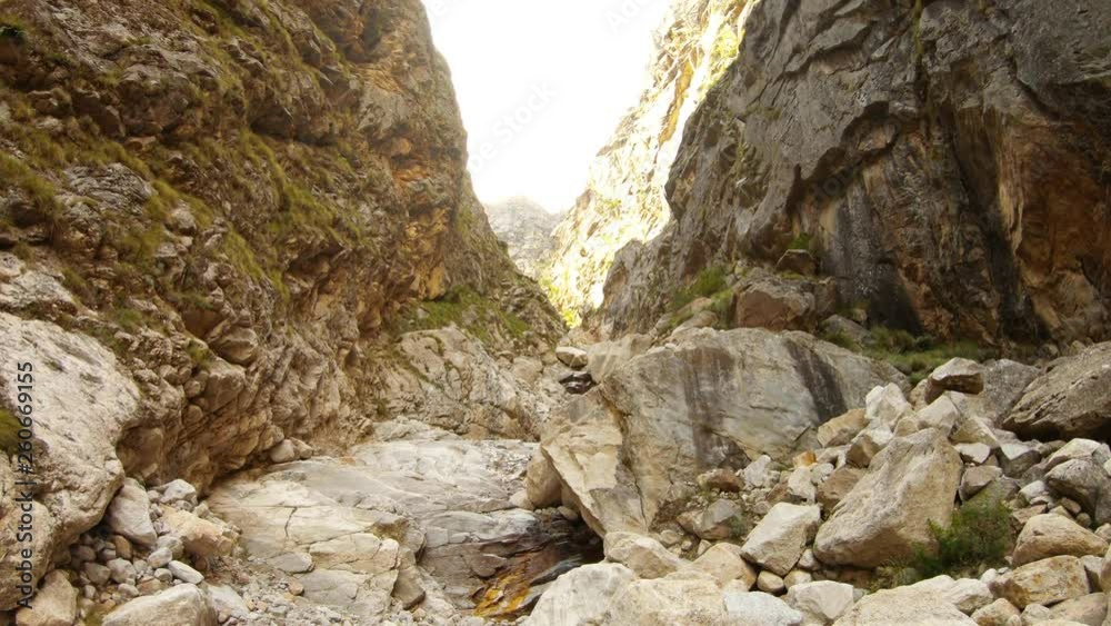 craggy ravine cliffs in low white clouds high mountains of Himalaya craggy ravine cliffs in low white clouds high mountains of Himalaya