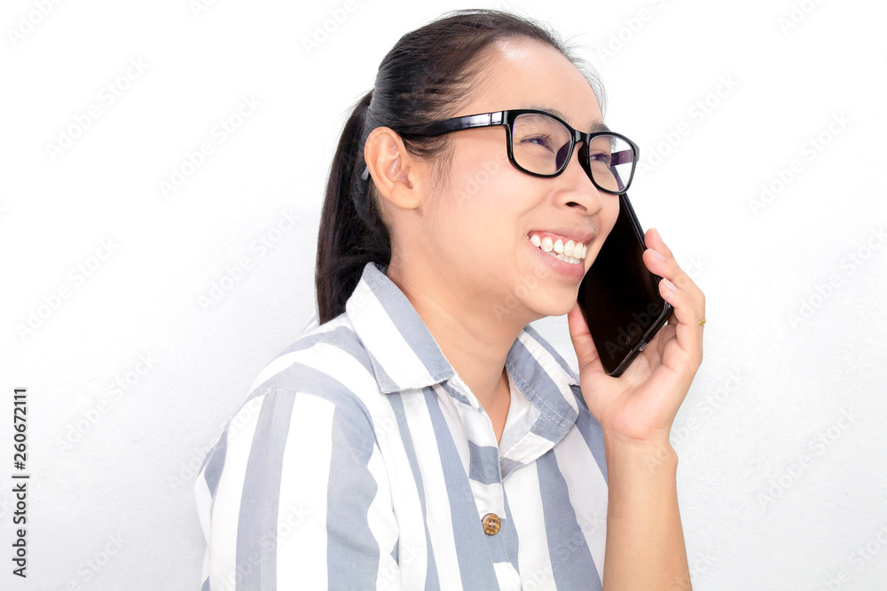 Cheerful Business Asian young woman talking on the phone over white background, Happy and smiling face. Cheerful Business Asian young woman talking on the phone over white background, Happy and smiling face.