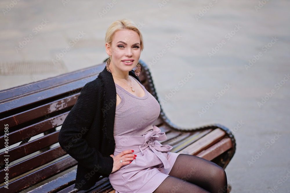 Portrait of a beautiful woman with blond hair, outdoors