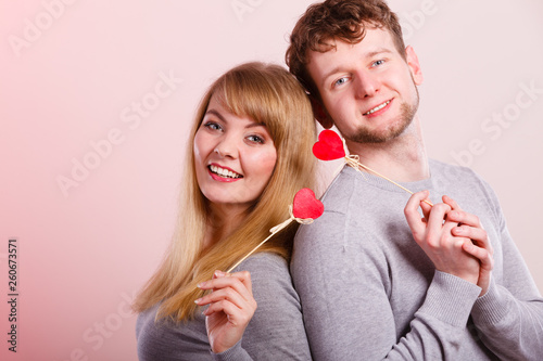 Lovely happy couple with hearts.