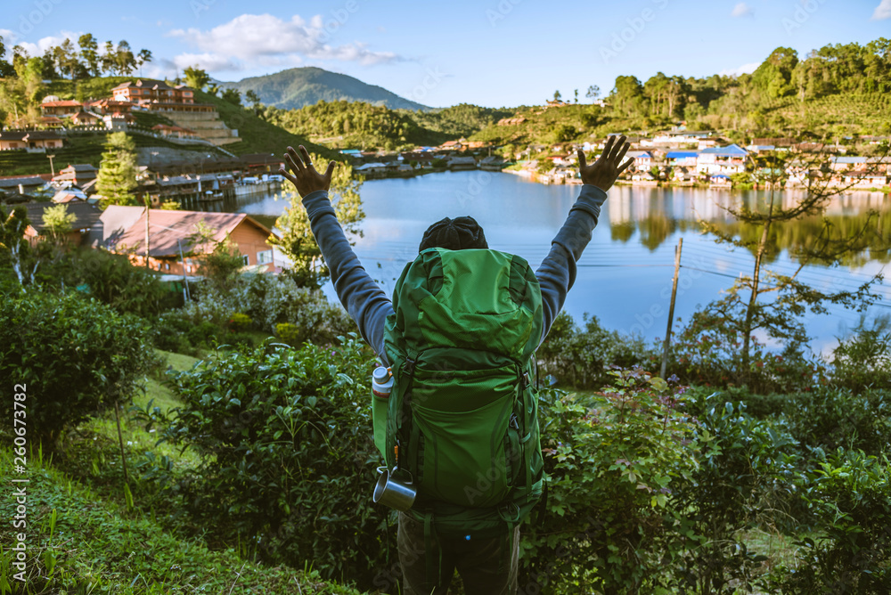 Obraz premium Asian man Camping Hiking Journey Travel Trek Concept, Holiday travel, Travel relax, Natural Touch countryside, in Thailand.