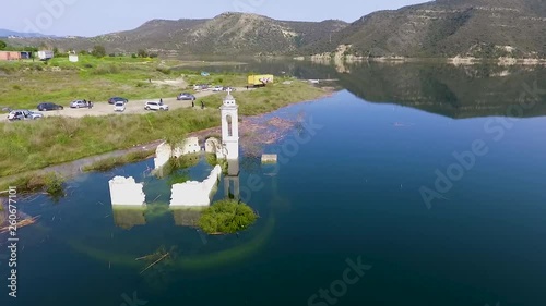 Abandoned old church immersed under reservoir water in Cyprus photo