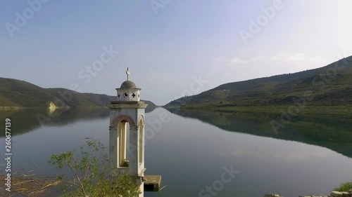 Abandoned old church immersed under reservoir water in Cyprus photo