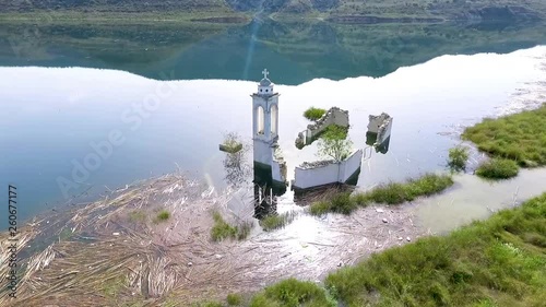 Abandoned old church immersed under reservoir water in Cyprus photo
