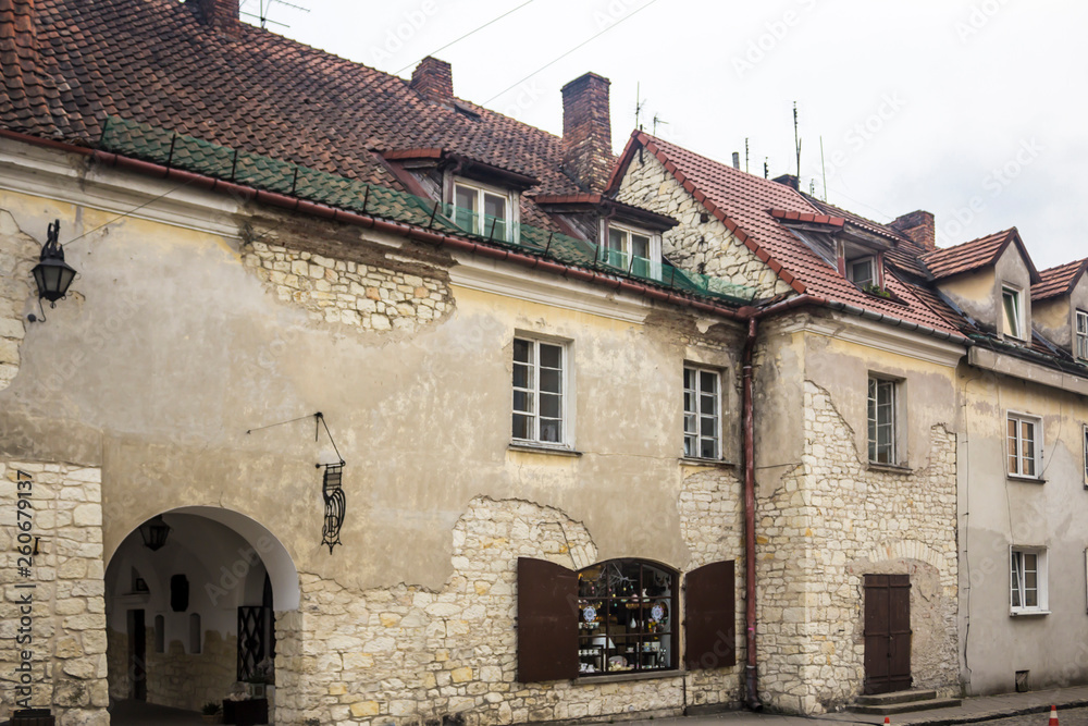 Old stone houses on the market square. The walls are made of limestone. Kazimierz Dolny is a medieval city over the Vistula.