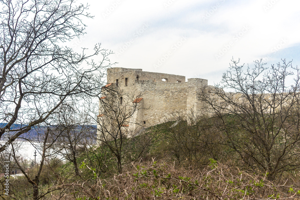 The ruins of an old castle on a hill. Built of limestone. Kazimierz Dolny is a medieval city over the Vistula.