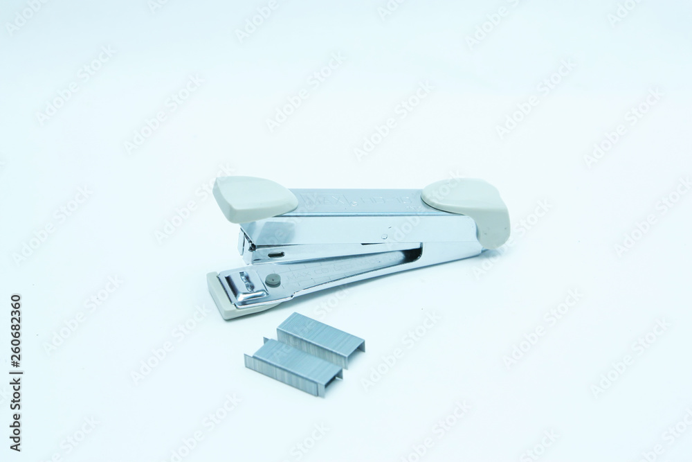 Stapler and staple on plain white background Stapler and staple on plain white background