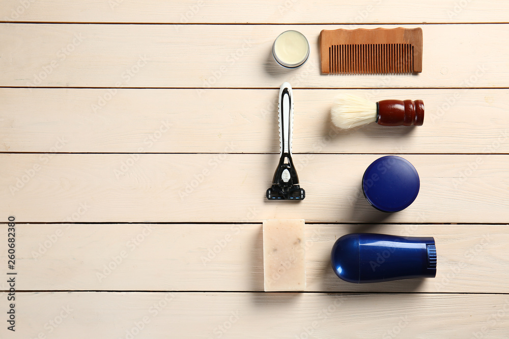 Set of male shaving accessories on wooden background Set of male shaving accessories on wooden background