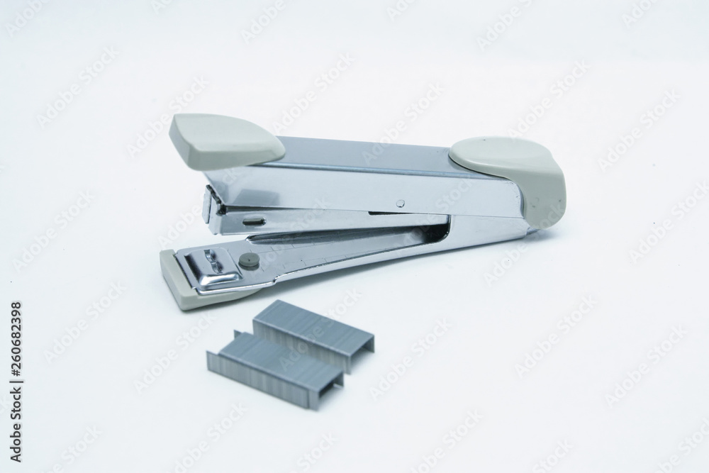 Stapler and staple on plain white background Stapler and staple on plain white background