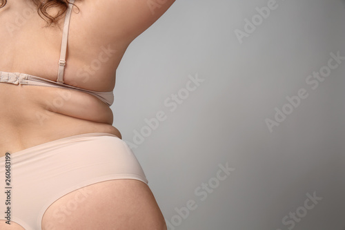 Photography Overweight woman on grey background