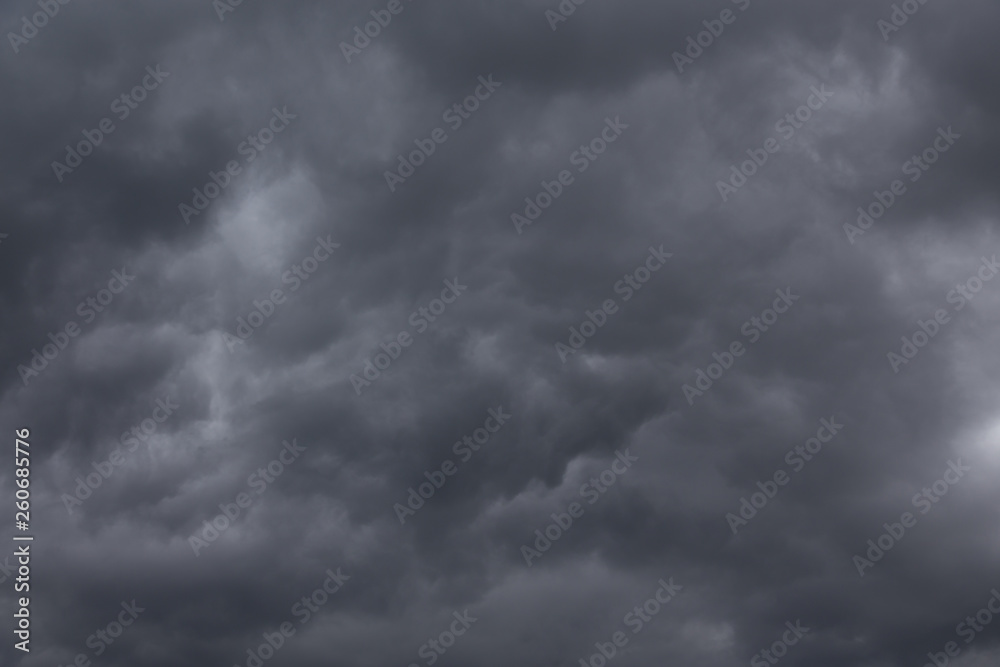 Dark stormy clouds background. Dramatic stormy sky with dark heavy clouds. Dark stormy clouds background. Dramatic stormy sky with dark heavy clouds.