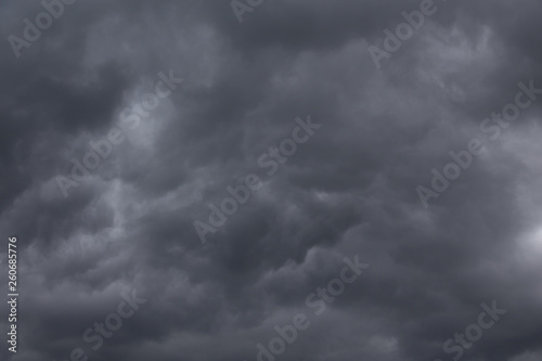 Dark stormy clouds background. Dramatic stormy sky with dark heavy clouds.