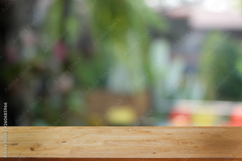 Empty dark wooden table in front of abstract blurred bokeh background of restaurant . can be used for display or montage your products.Mock up for space. Empty dark wooden table in front of abstract blurred bokeh background of restaurant . can be used for display or montage your products.Mock up for space.