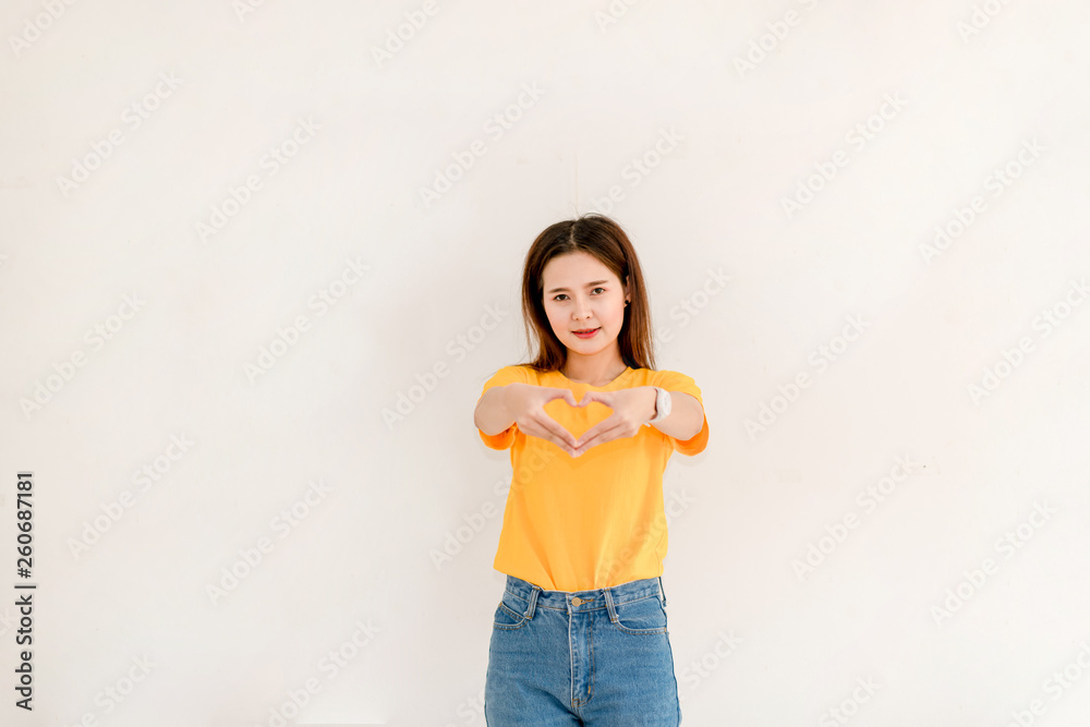 The image of a beautiful Asian woman smiling brightly on a white background The image of a beautiful Asian woman smiling brightly on a white background