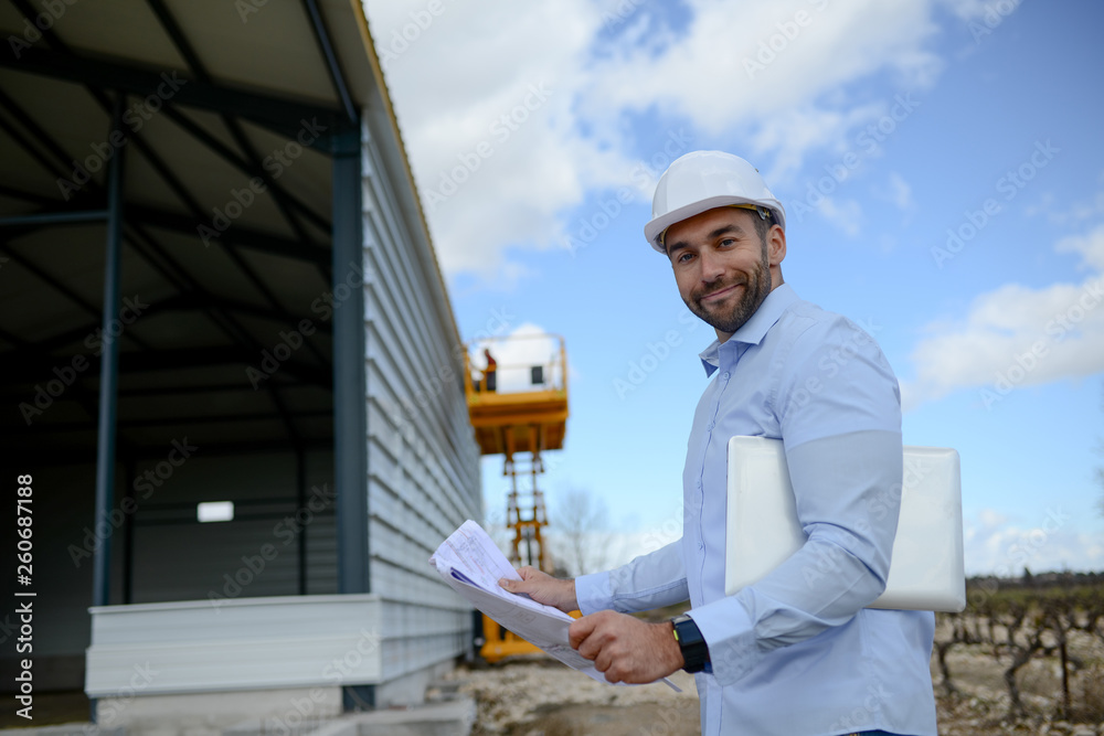 portrait of a handsome young man architect on a building industry construction site portrait of a handsome young man architect on a building industry construction site