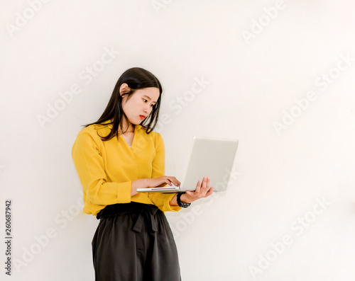 Smile Asian girl holding a laptop computer separately on a white background.