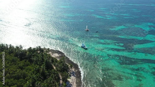 Wallpaper Mural Aerial view from drone on tropical beach with coconut palm trees and speed boats shipping in caribbean sea Torontodigital.ca