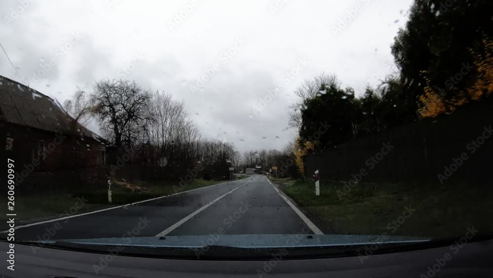 951-07 Car Ride Dashboard Center View Exiting Village In Rain With Windscreen Wipers On Long 951-07 Car Ride Dashboard Center View Exiting Village In Rain With Windscreen Wipers On Long