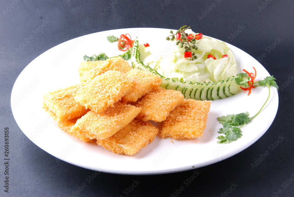 fried fish with lemon and parsley on plate fried fish with lemon and parsley on plate