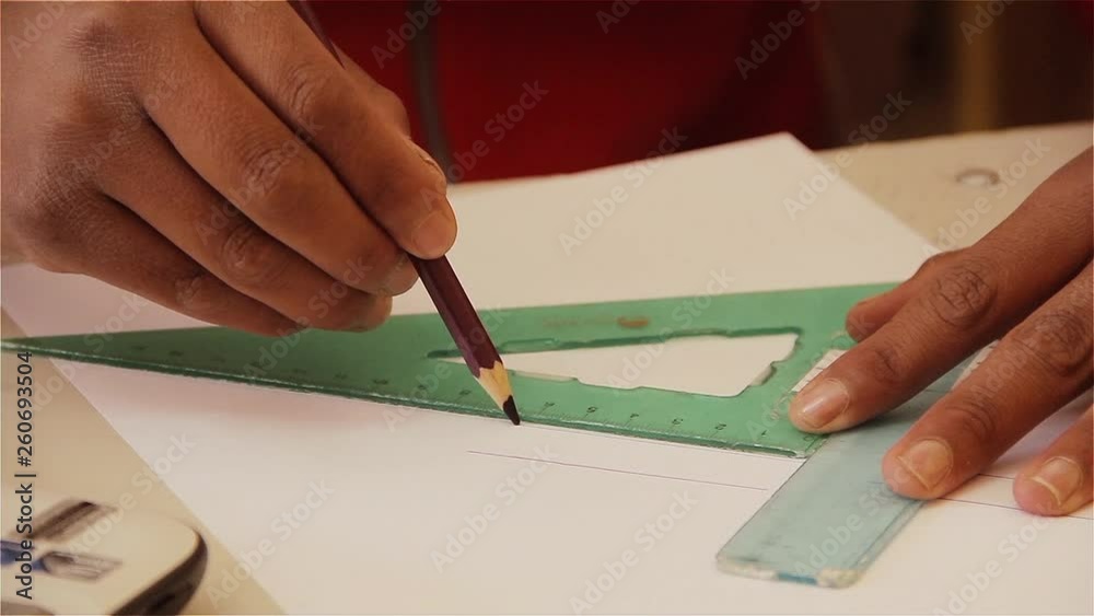 Hands of a Argentine Male School Boy using A Ruler and Triangle Ruler ...
