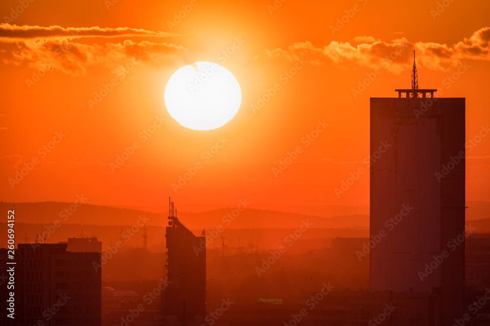 Ekaterinburg, Russia - Jule, 2018: Telephoto lens panoramic shot of cityscape view megalopolis during sunset at summer evening